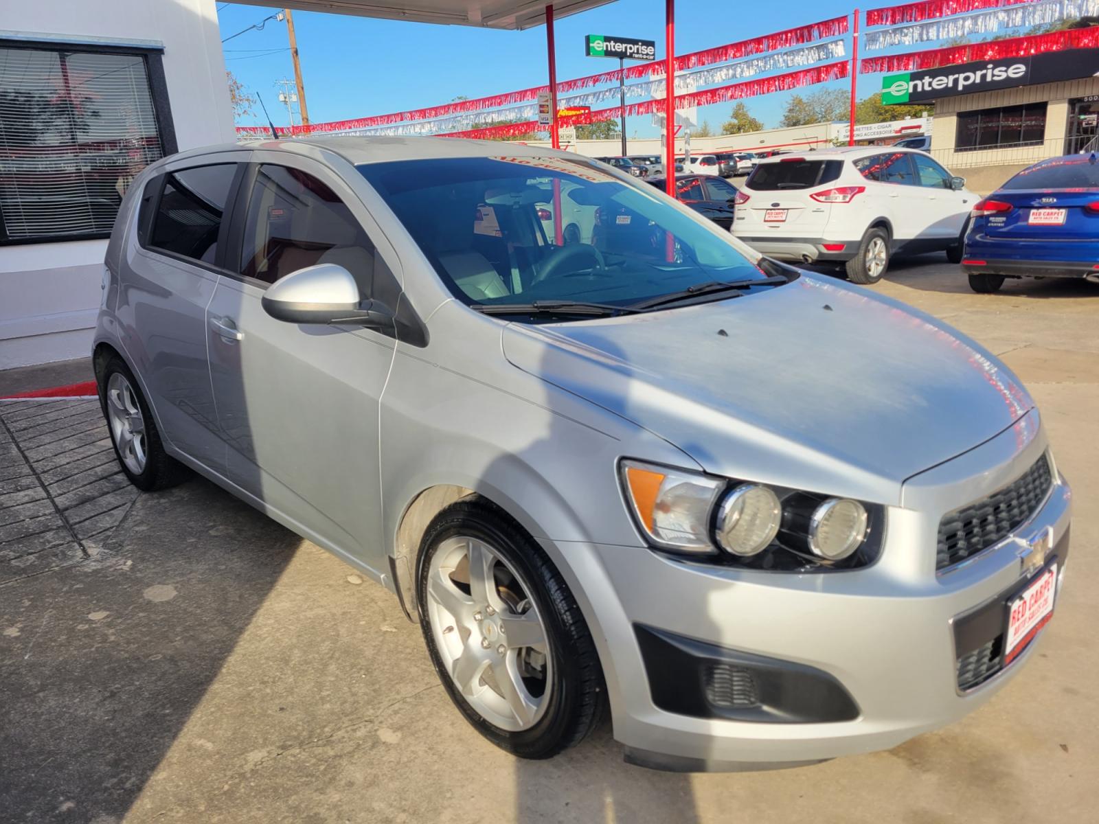 2014 SILVER Chevrolet Sonic (1G1JB6SH6E4) with an 1.8L I4 F DOHC 16V engine, Manual Transmission transmission, located at 503 West Court, Seguin, TX, 78155, (830) 379-3373, 29.568621, -97.969803 - 2014 Chevrolet Sonic LS Manual 5-Door with a 1.8L I4 F DOHC 16V, Standard Transmission, Tilt, AM/FM/AUX Stereo, Power Locks, Bluetooth, Tinted Windows, Onstar Capability, Alloy Wheels, Rear Wiper, Rear Defroster - Photo #1